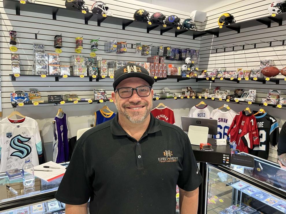 The owner of East West Sports Cards