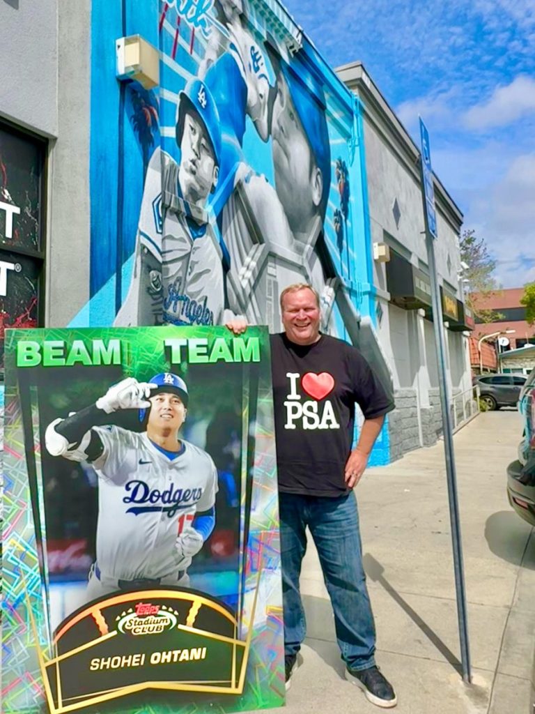 PSA Employee Chris Carlin Delivers Oversized Topps Card Displays to LA Hobby Shops