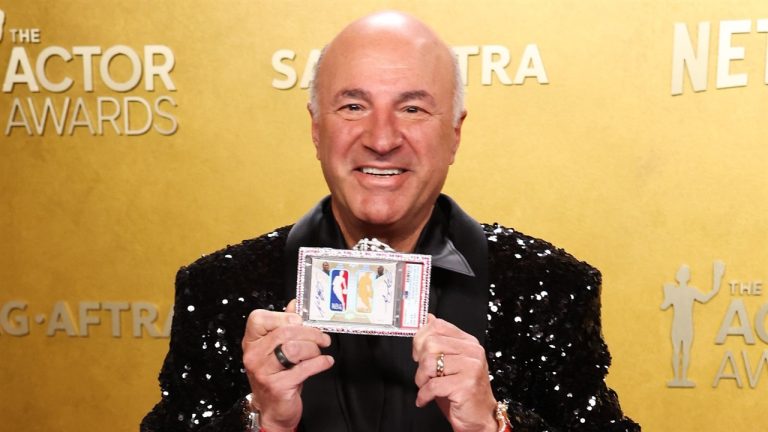 Kevin O'Leary at 2026 SAG Awards holding the Jordan-Kobe dual Logoman card